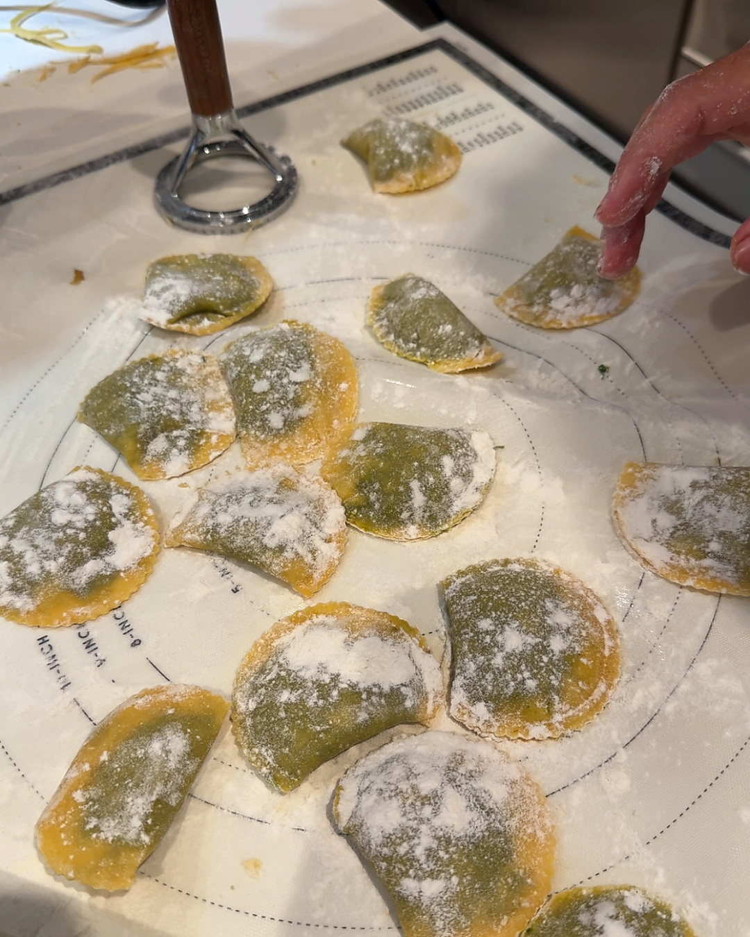 Hand-cut ravioli dusted with flour.