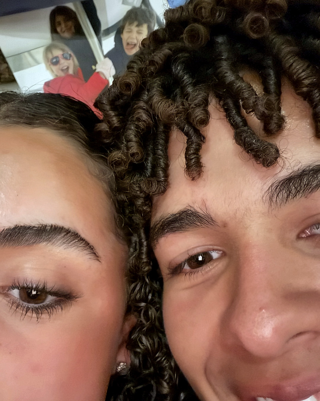 A close-up of their faces pressed together.