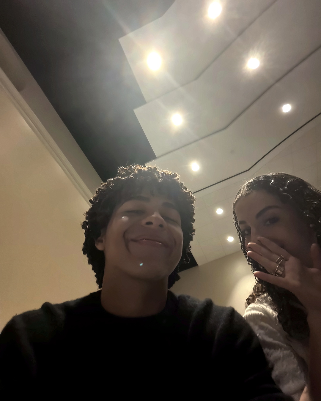 Selfie indoors with Elena half-hidden.